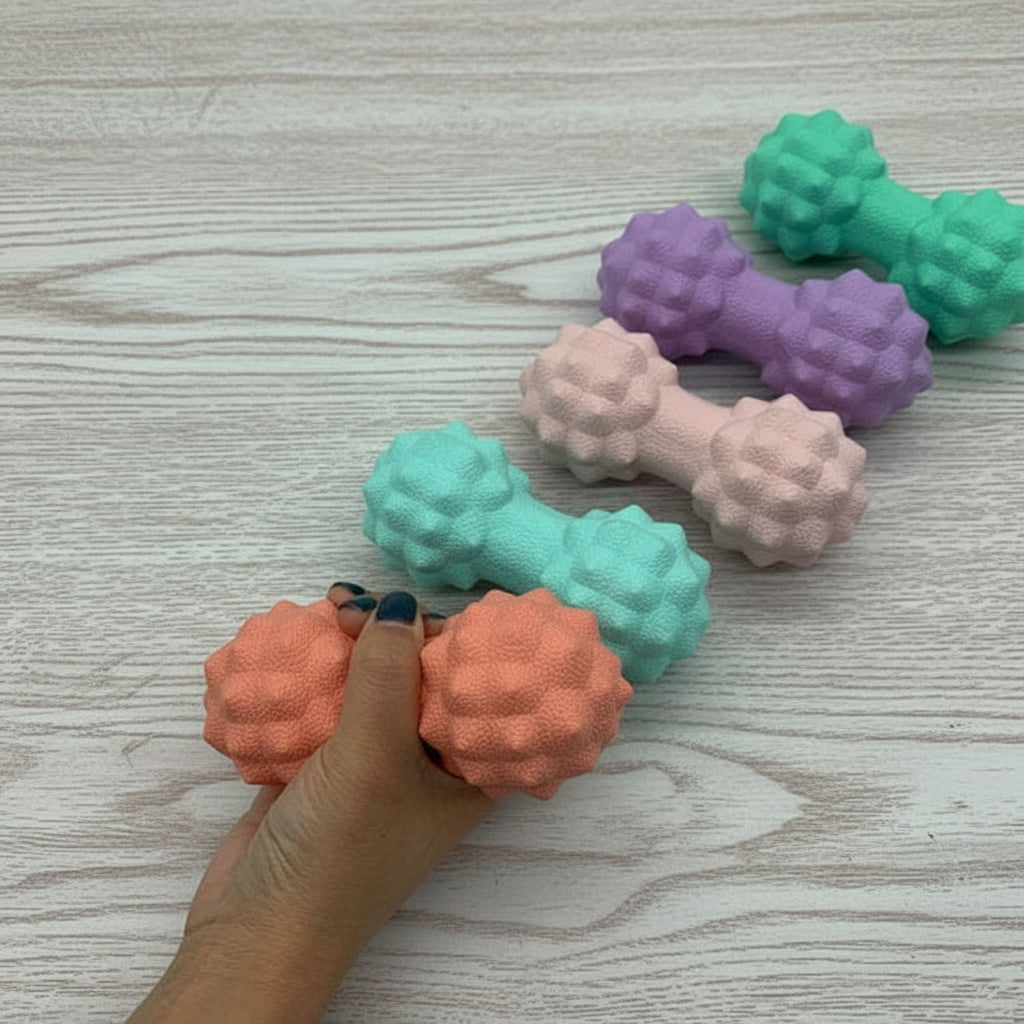 boule de massage couleurs différente sur table de bois