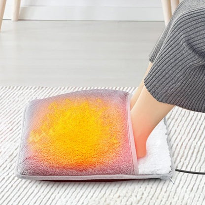 Coussin Chauffant pour Pieds sur un tapis gris