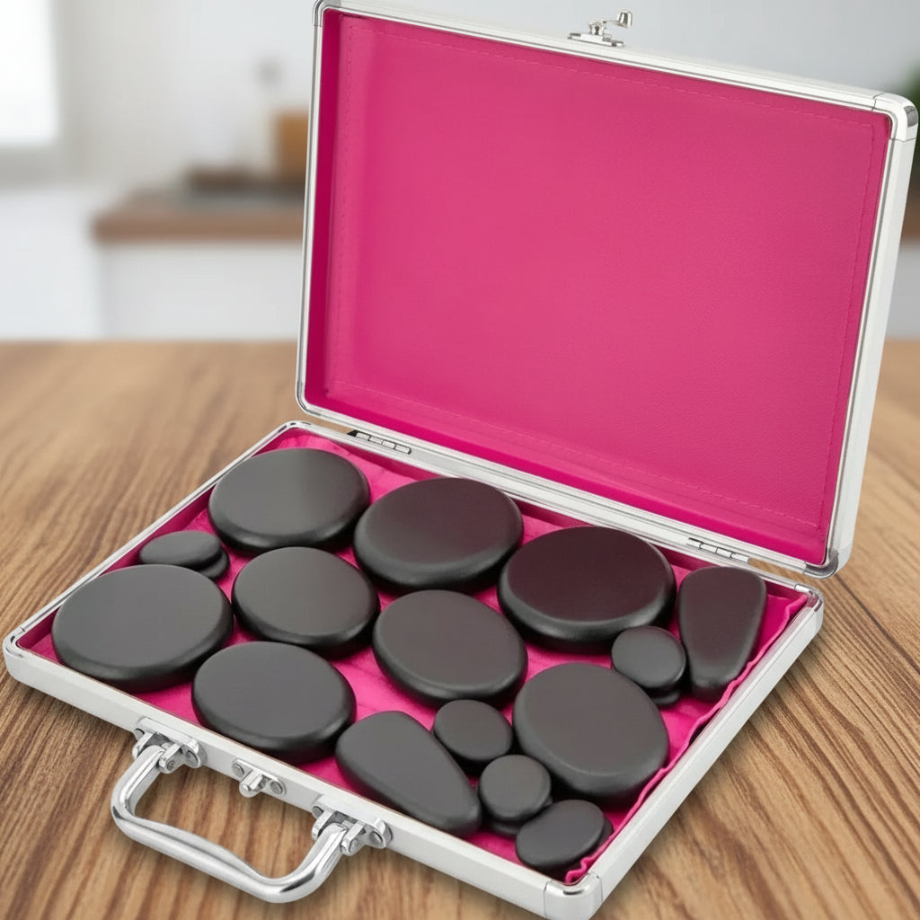 coffre rouge de massage aux pierres chaudes noir sur table de bois