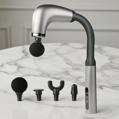 pistolet de massage sur table de marbre