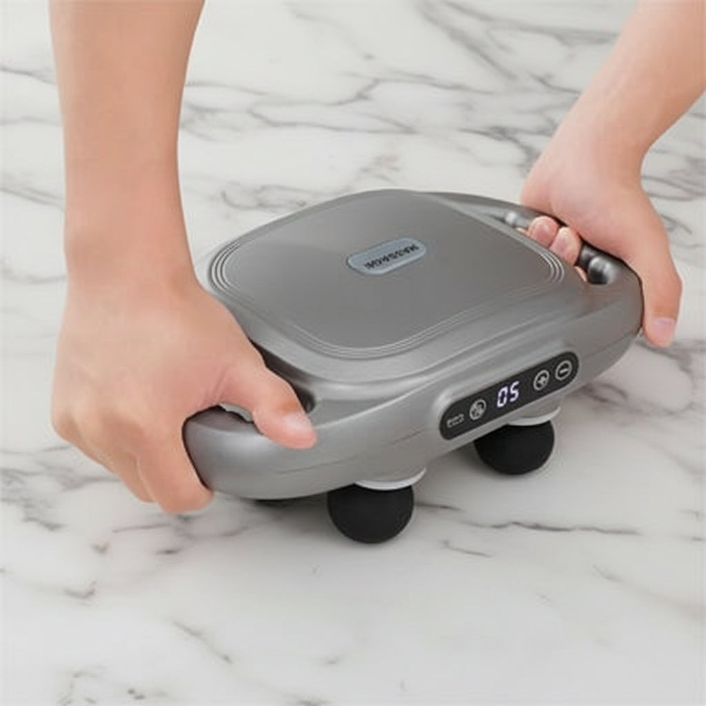 pisolet de massage sur table de marbre