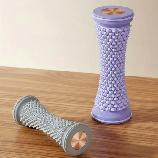 paire de rouleau de massage sur une table de bois