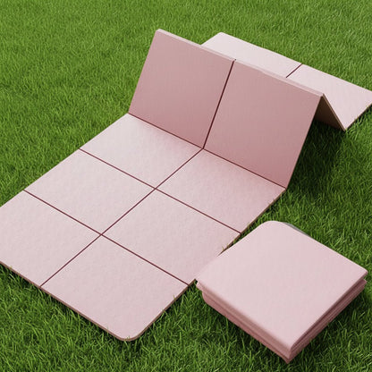 Tapis de gym rose sur pelouse vert